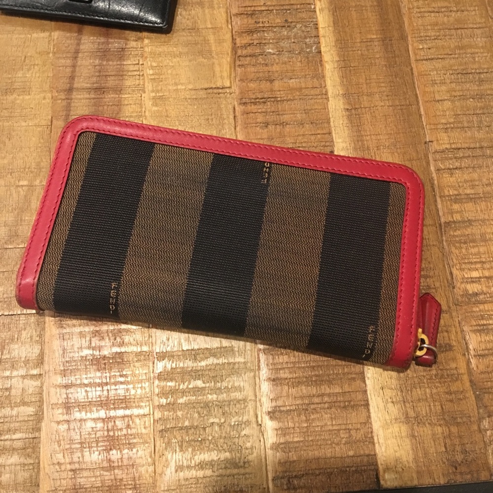 Authentic fendi zip around wallet with red trim